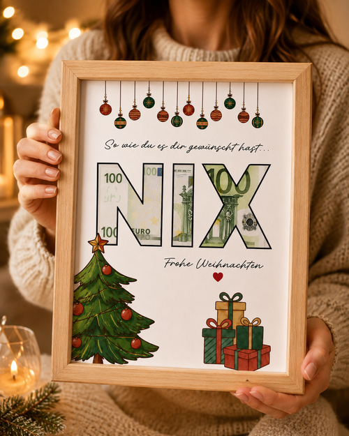 Person hält digitales Geldgeschenk zu Weihnachten im Holzbilderrahmen mit originellem NIX-Motiv und Geldschein im A4-PDF zum Ausdrucken.