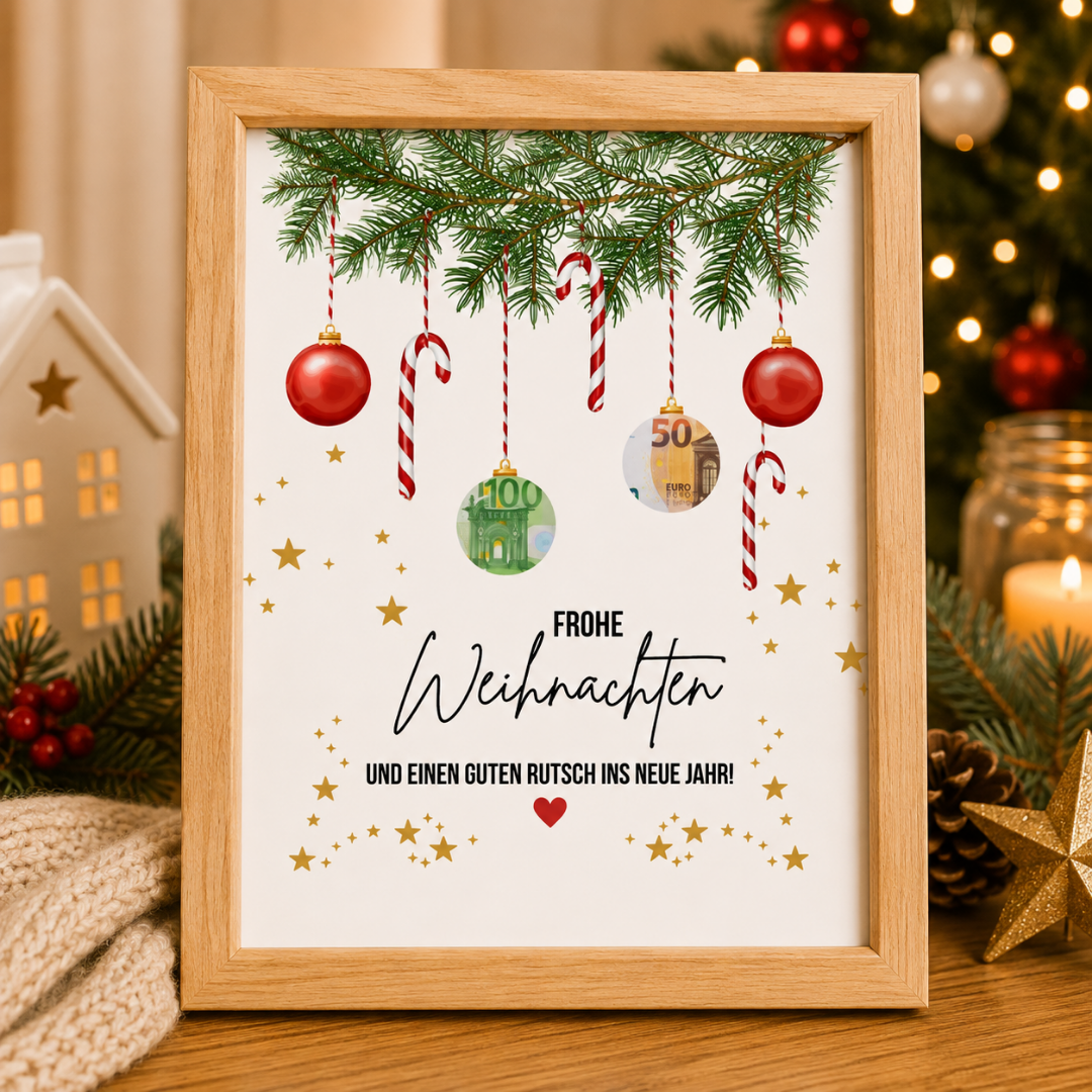 Person hält ein digitales Geldgeschenk mit Weihnachtskugeln im Bilderrahmen – Weihnachtsgeschenk als PDF zum Ausdrucken.